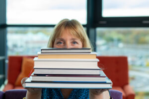 Jayne Packham holding books