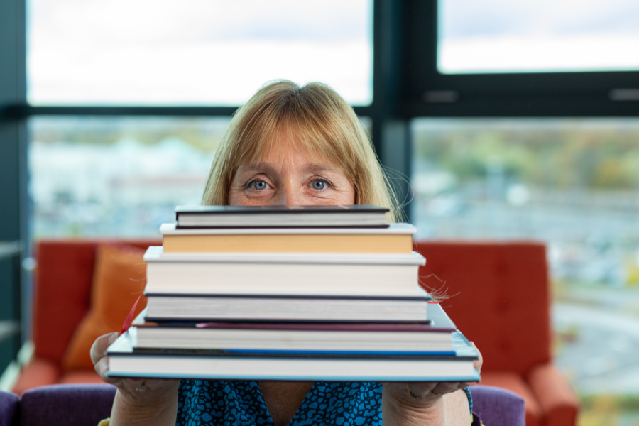 Jayne Packham holding books